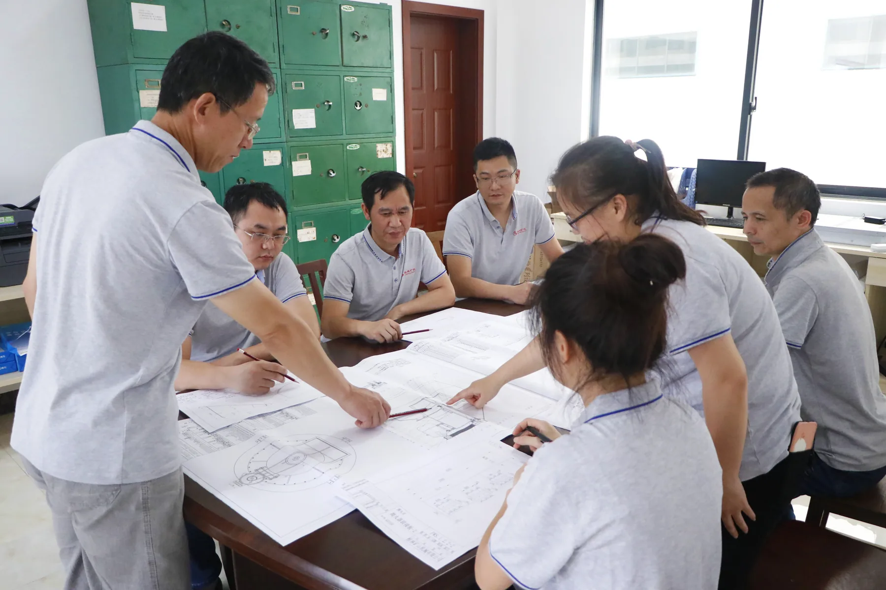 Cronus engineering team reviewing equipment